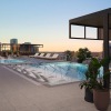 a swimming pool with a building behind it