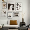 a living room with a white couch, a window and a coffee table